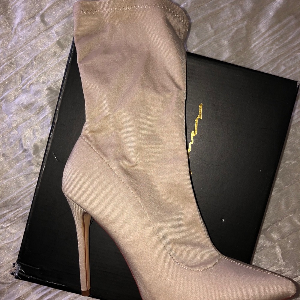 Beige pointed toe booties